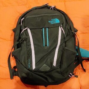 The North Face Men's Dark Green Backpack with Teal Accents
